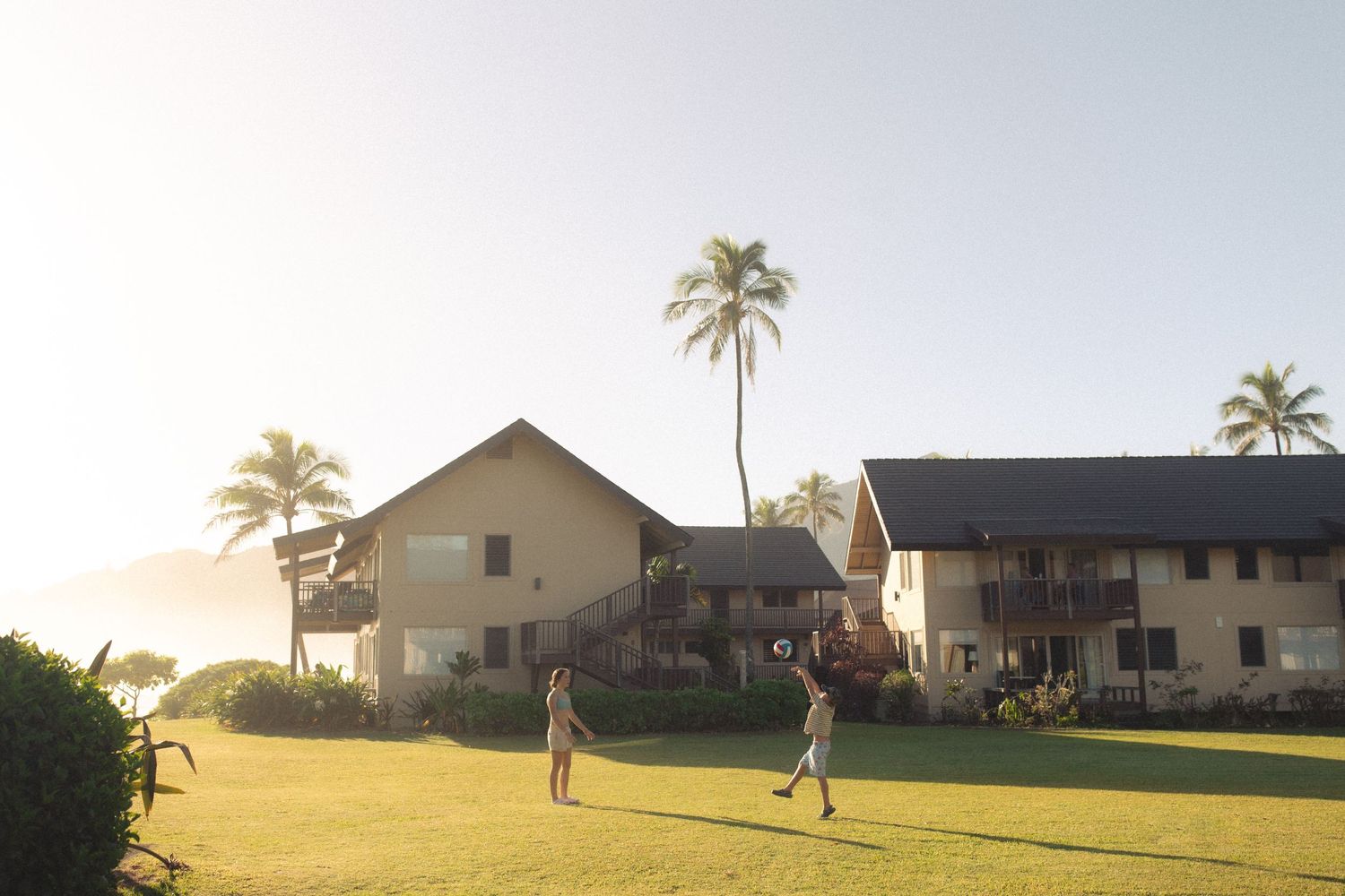 kids playing outside hotel at beach resort in hawaii