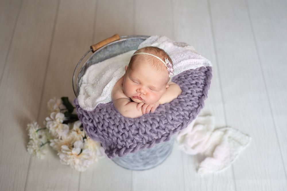 posed newborn baby photography bucket prop pose in studio Cobourg, Ontario*