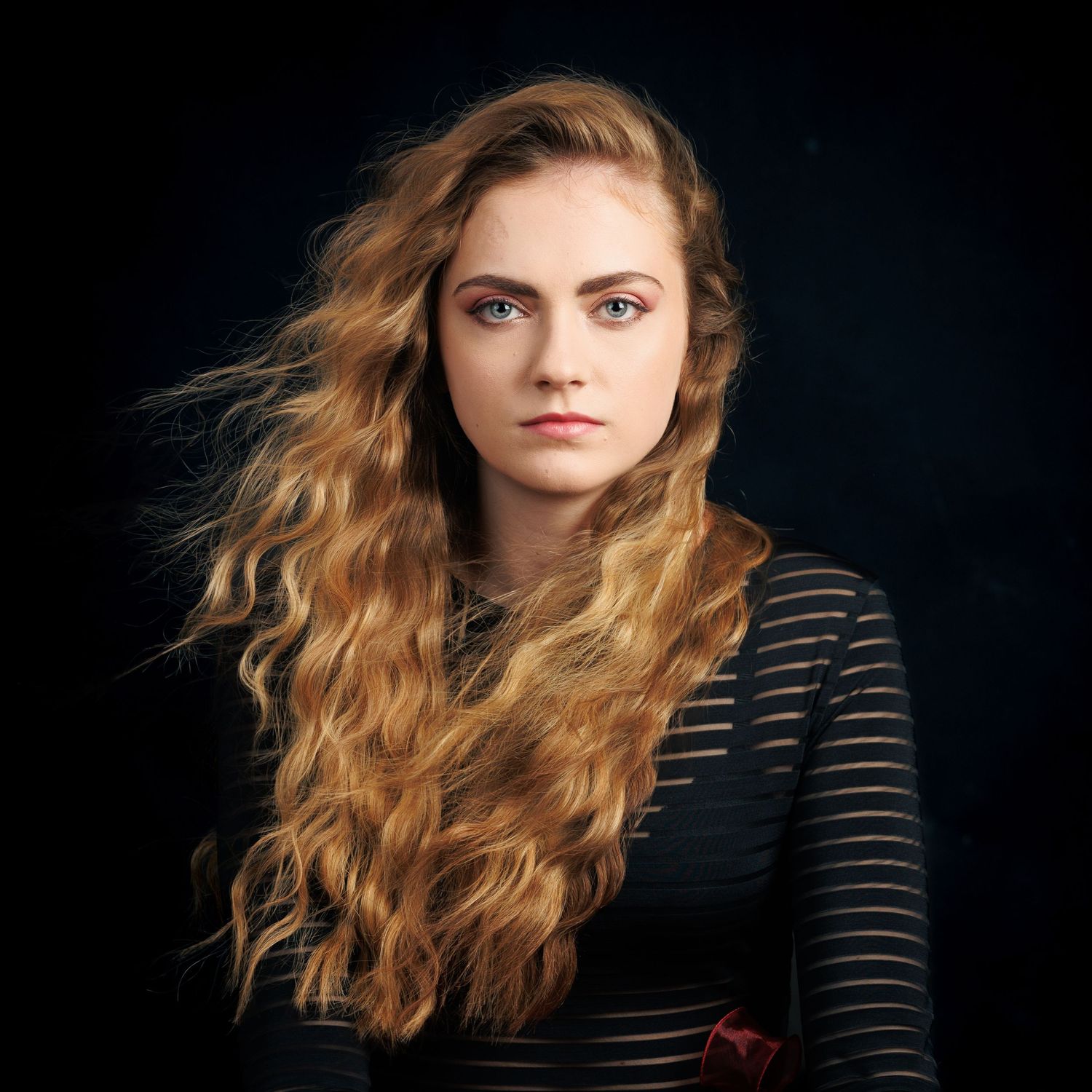 Natural beauty. Waved hair with movement