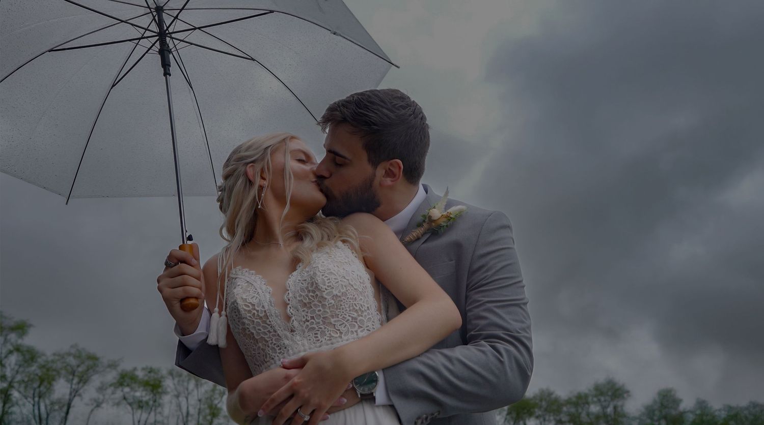 Romantic sunset wedding portrait session with couple in elegant attire sharing intimate moments.