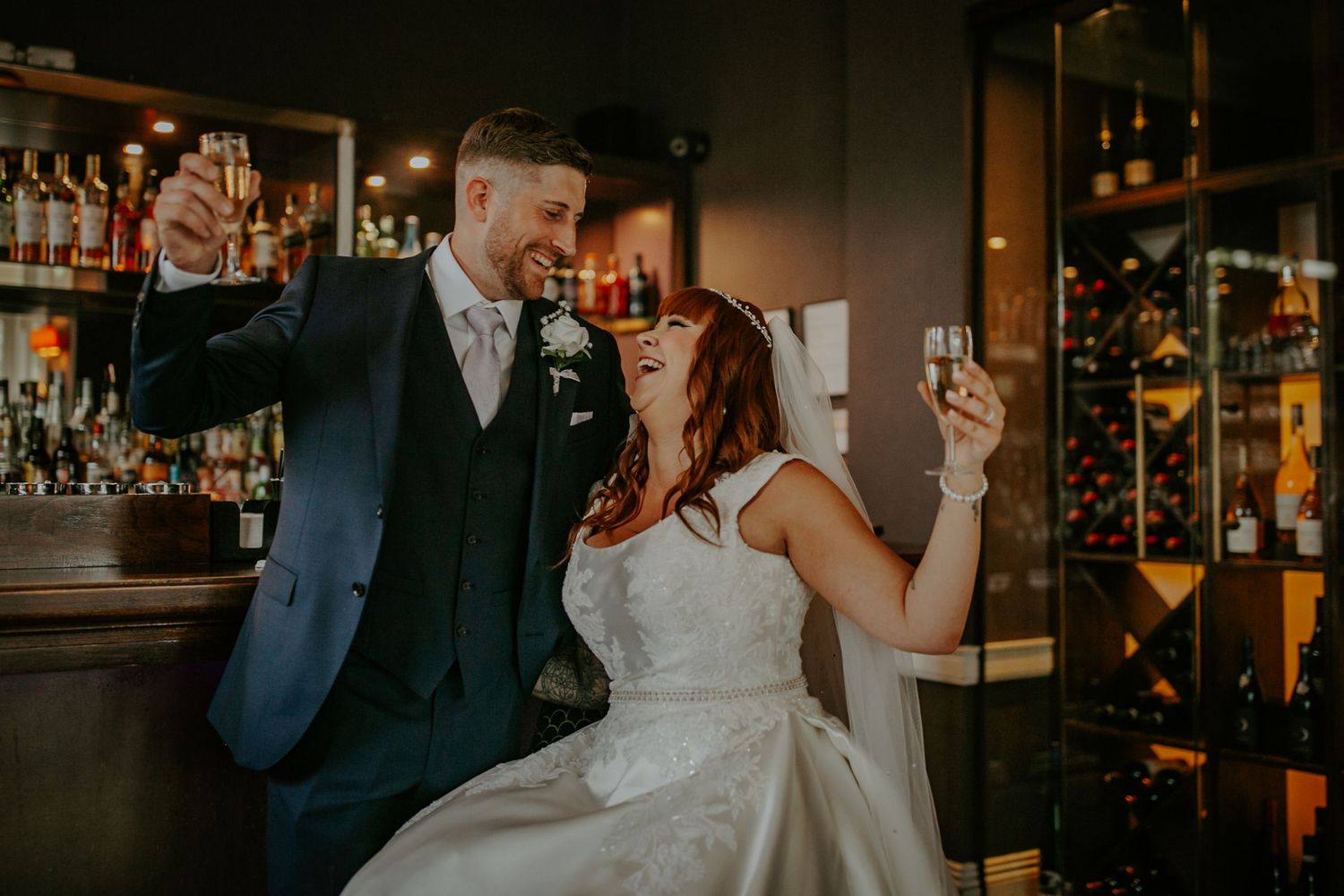 Bride and groom at the bar of St Michaels Manor Hotel Wedding, St Albans, Hertfordshire