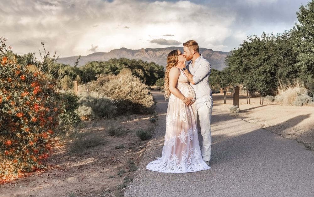 Maternity Phography featuring the Sandia Mountains and desert sky