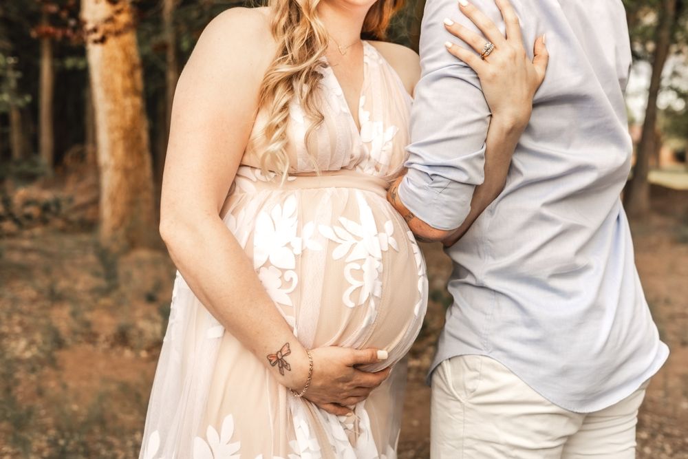 Mom and Dad with baby bump pregnancy Announcement