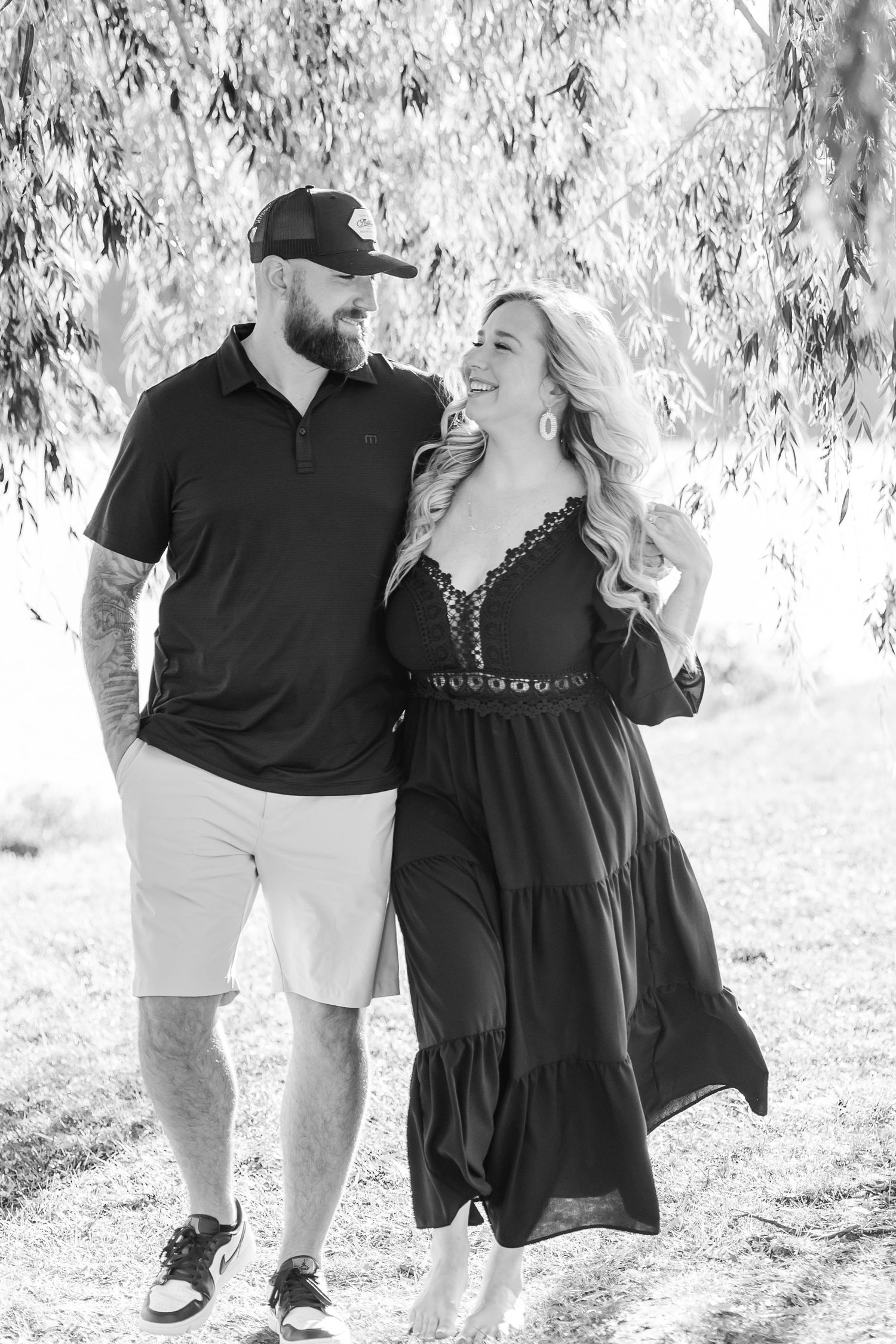 Black and white photos of couple walking and embracing outdoors.