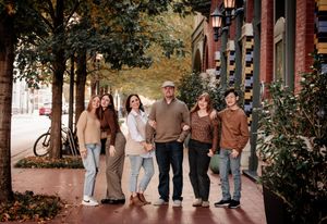 A series of casual group photos arranged in a horizontal strip showing people walking and posing together outdoors.