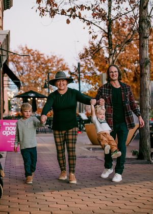 A sequence of candid walking shots on brick pavement with autumn trees in the background during golden hour.
