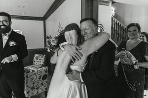 Black and white candid reception moments with guests celebrating.