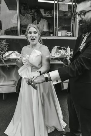 Black and white wedding photos showing joyful dancing and celebration moments.