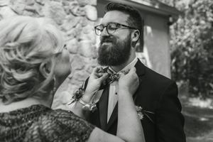 Black and white photos of emotional wedding moments captured during an outdoor ceremony.