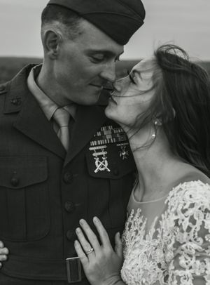 Black and white intimate portrait of military couple in vintage style.