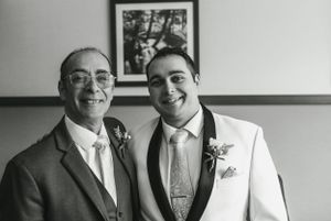 Classic black and white portrait of two people in formal attire.
