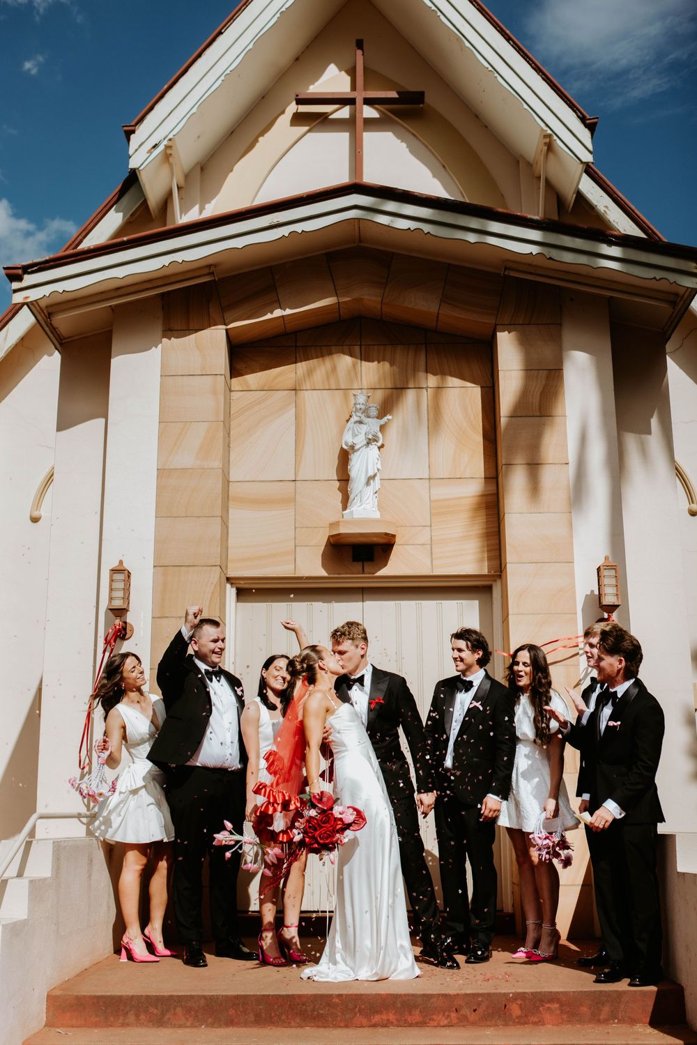 Wedding ceremony sequence outside a white chapel with confetti celebrations.