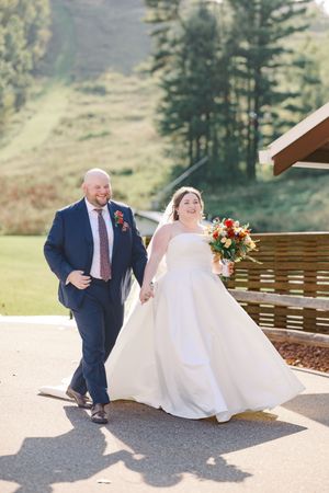 A series of wedding photos showing a couple dancing and twirling on an outdoor patio with mountain views.