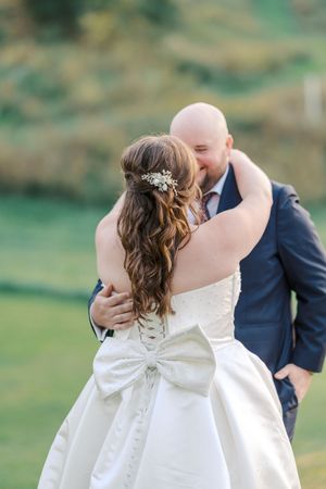 A romantic sequence of wedding photos showing a couple in white dress and navy suit sharing a tender kiss outdoors.