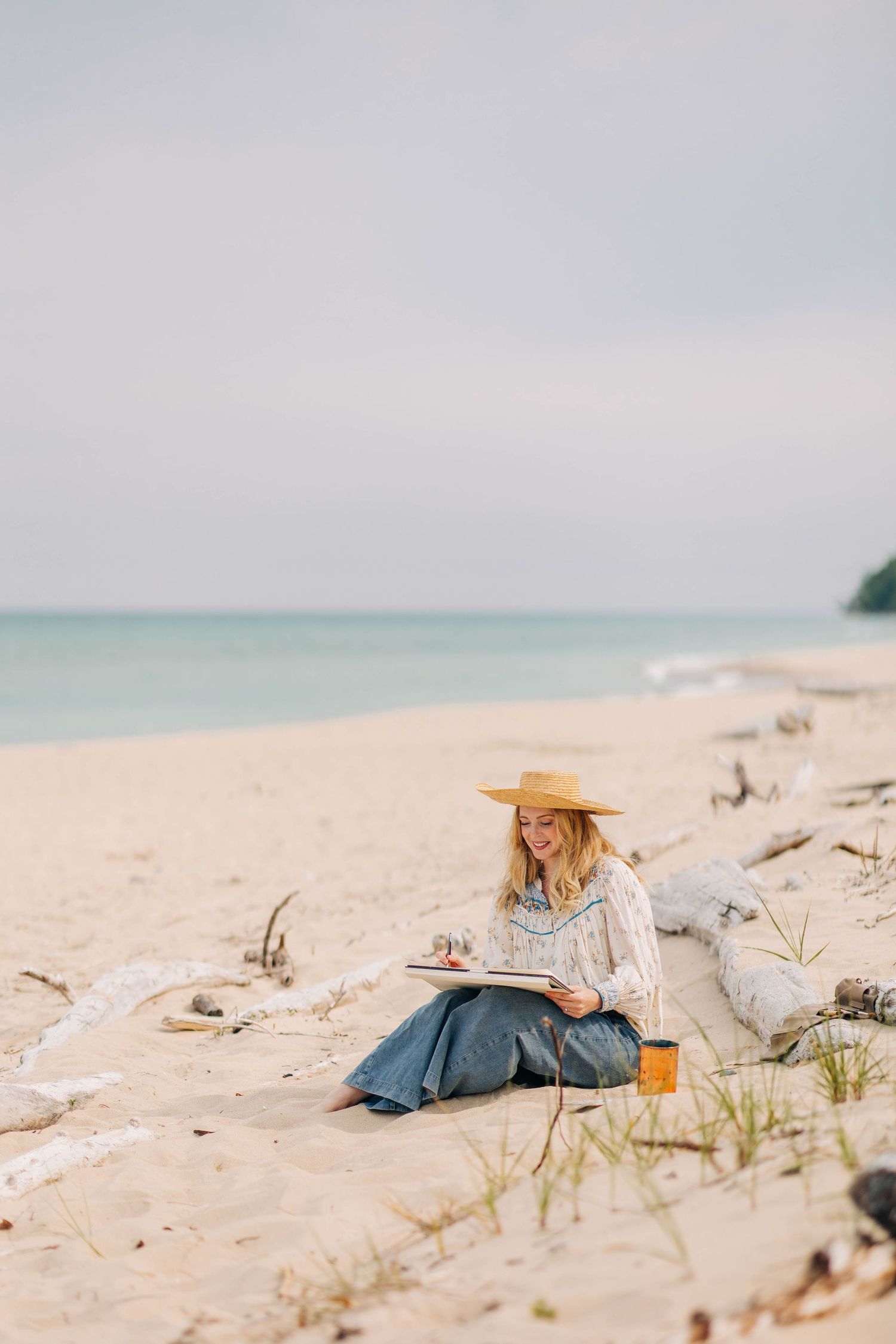 Kristin Mackenzie Design painting on North Beach in Leland, Michigan Captured By Grace Hudson Photography Traverse City