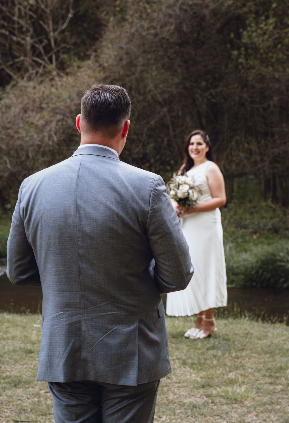 Wedding photography session in progress outdoors with natural backdrop.