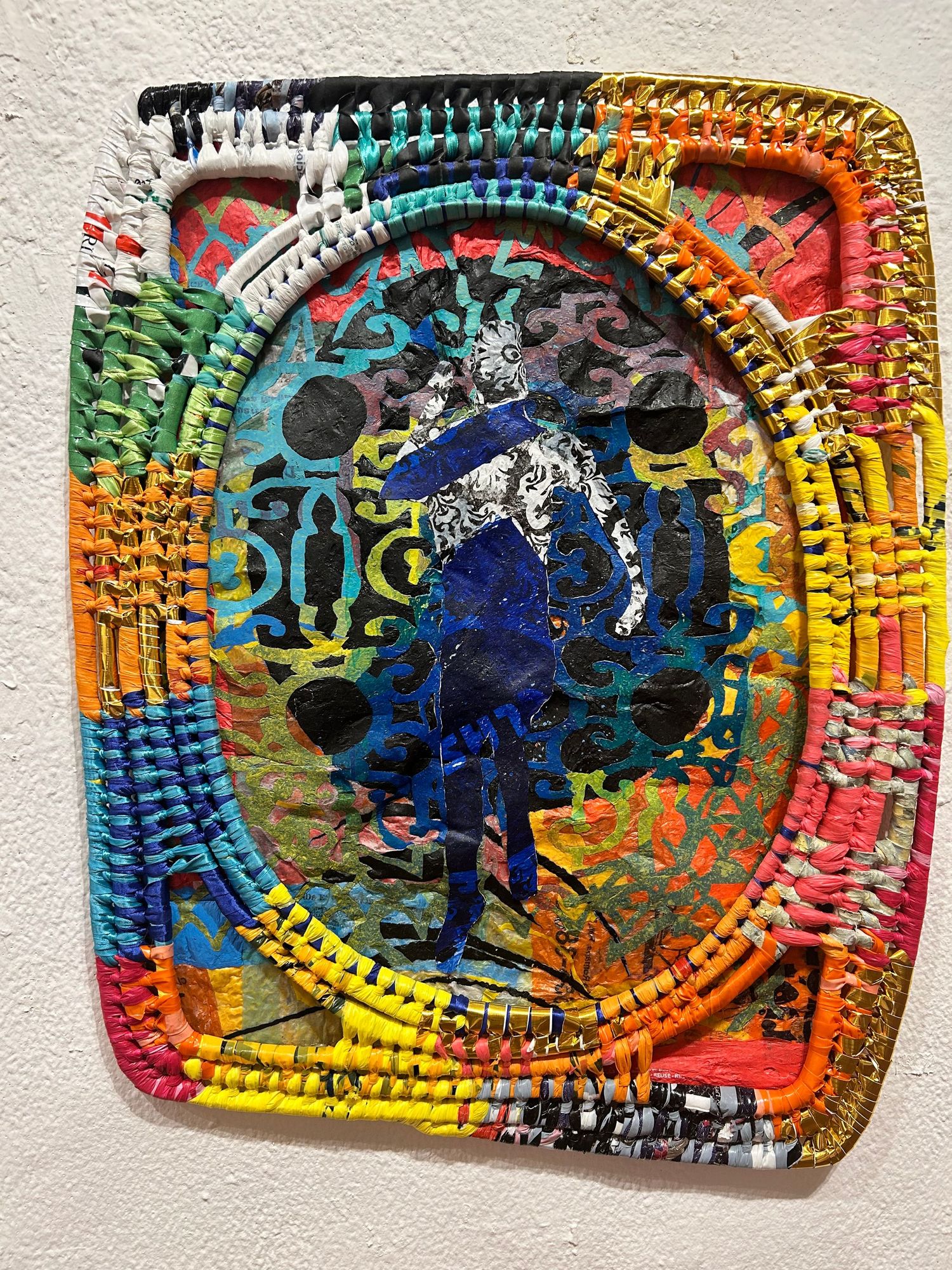Mixed plastic artwork with colorful border featuring a silhouetted figure in deep blue tones.