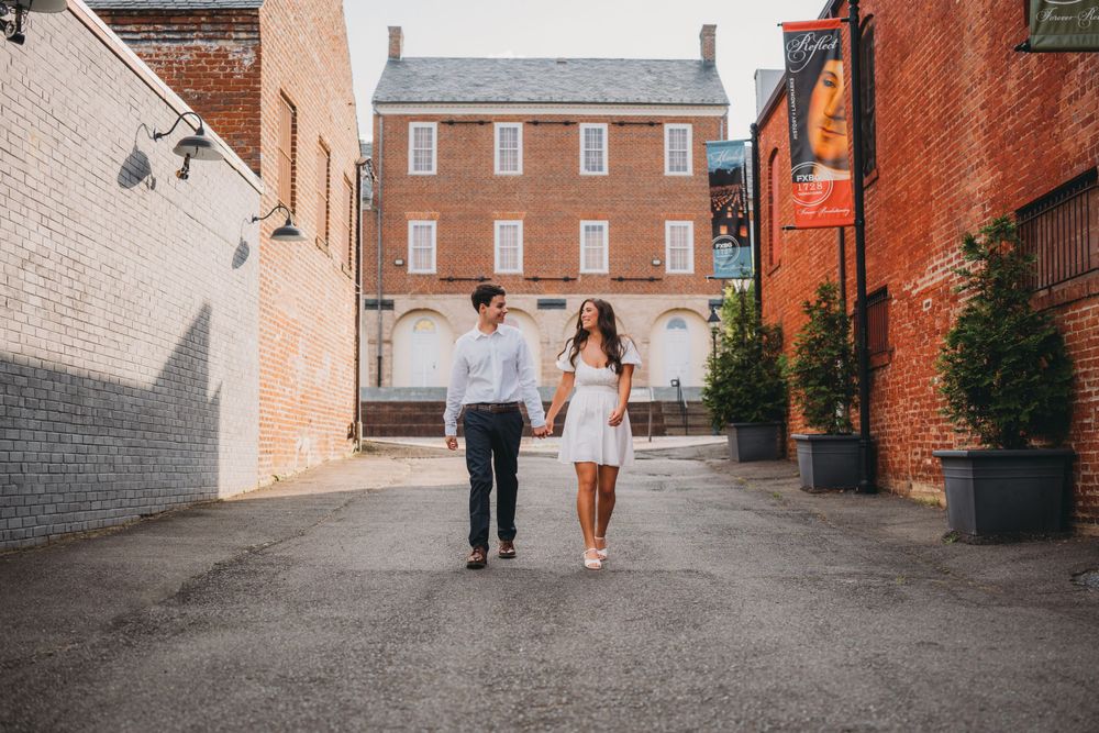 Boy and girl walk market square Engagement photography in Fredericksburg Virginia