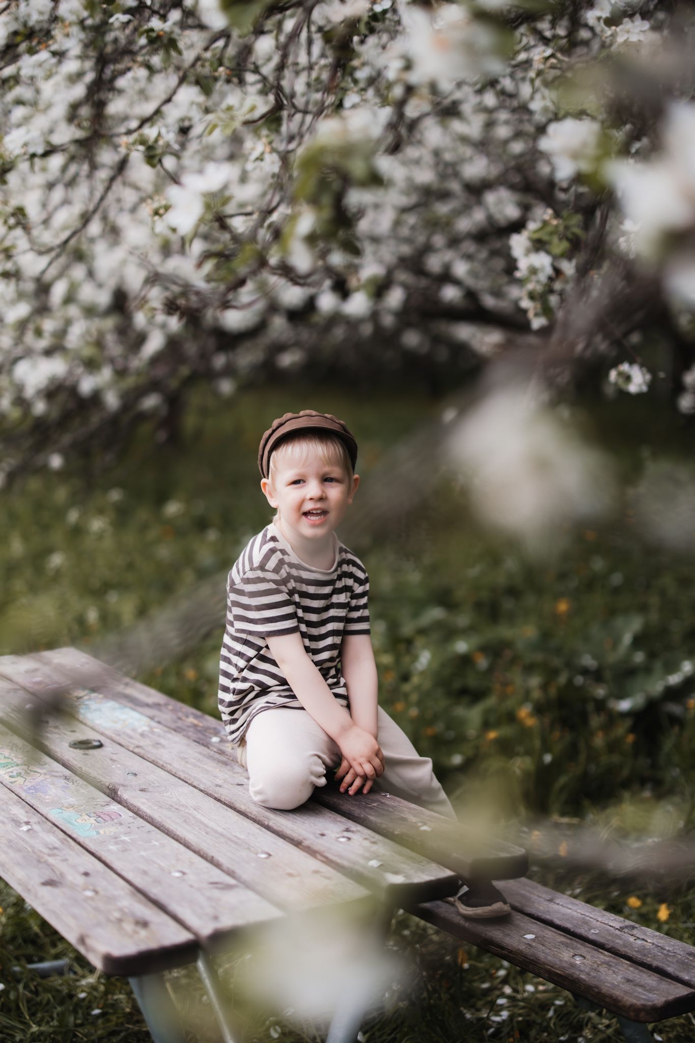 Boy sitting on piknik table