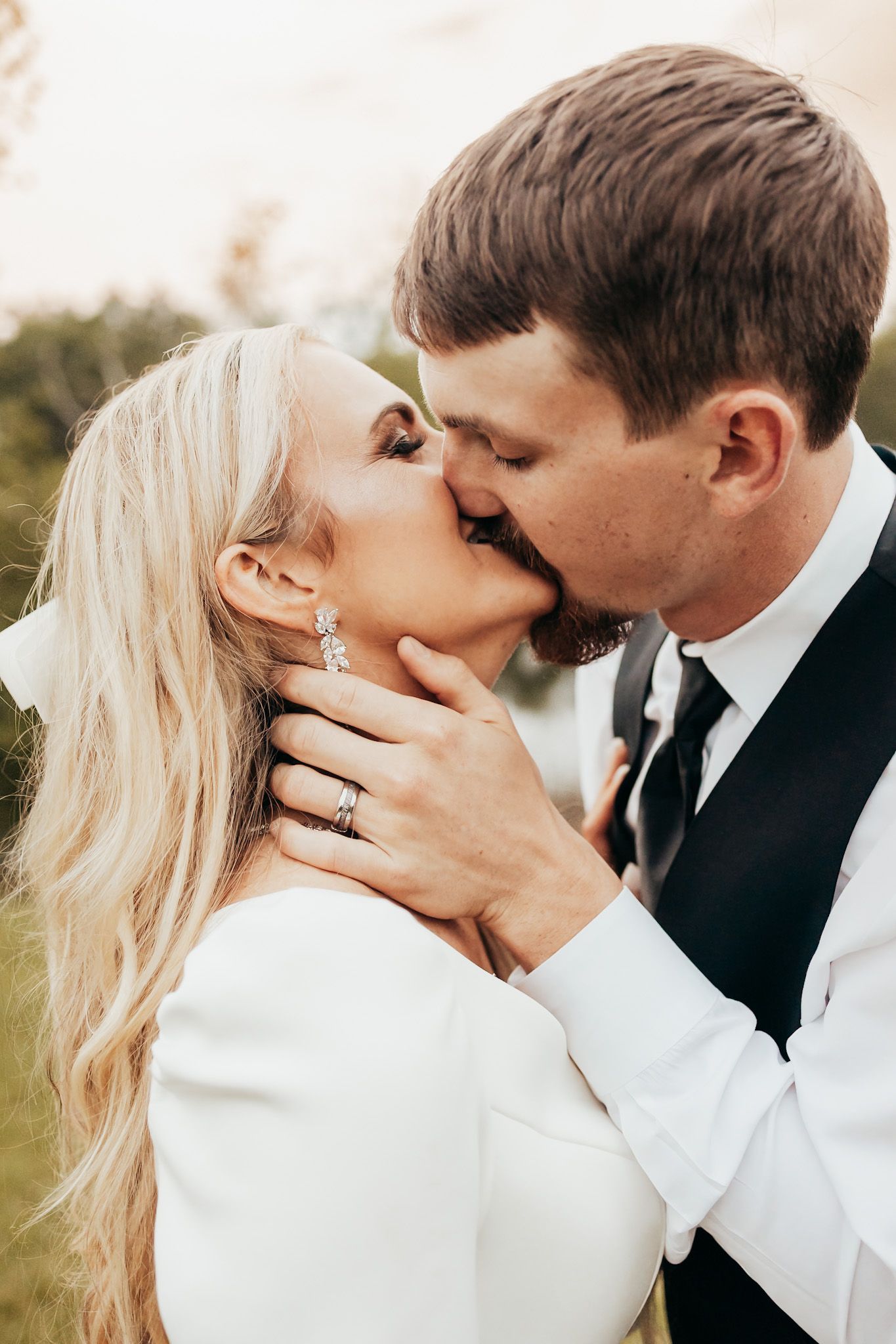 bride and groom up close kissing