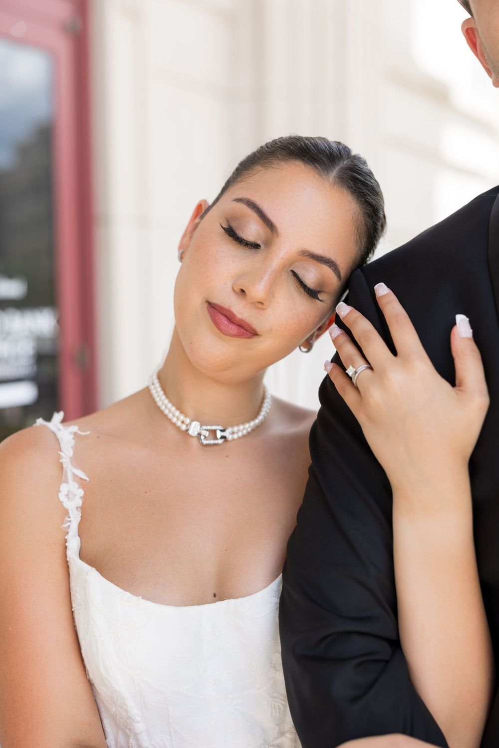 Close-up portraits of a bride with crystal jewelry and romantic expressions against a light background.