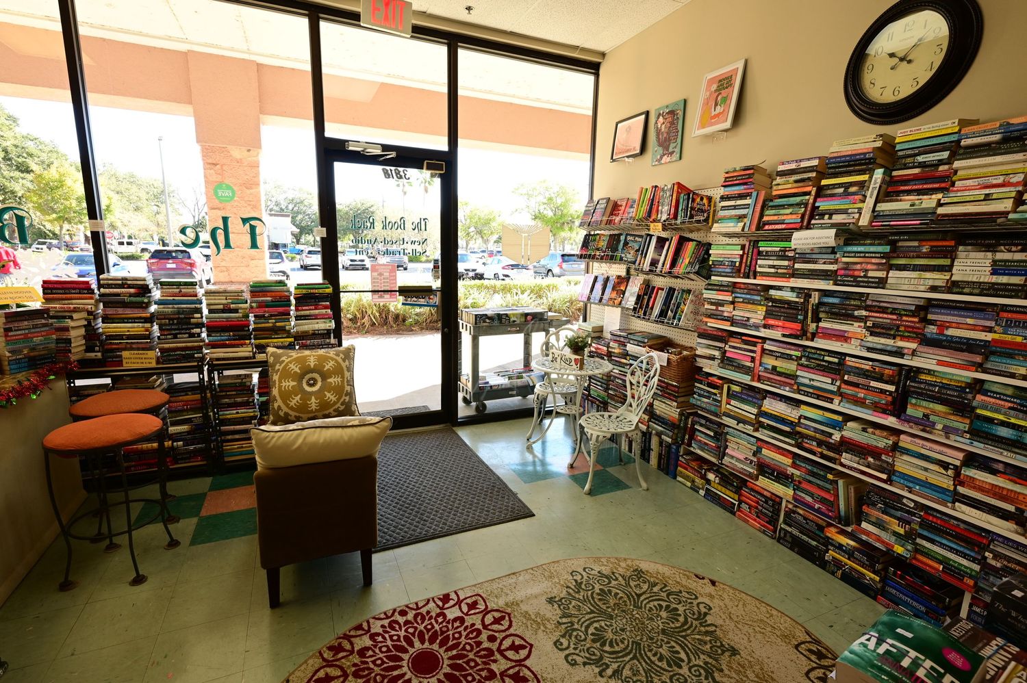 Panoramic view of a bookstore interior with multiple shelves filled with books.