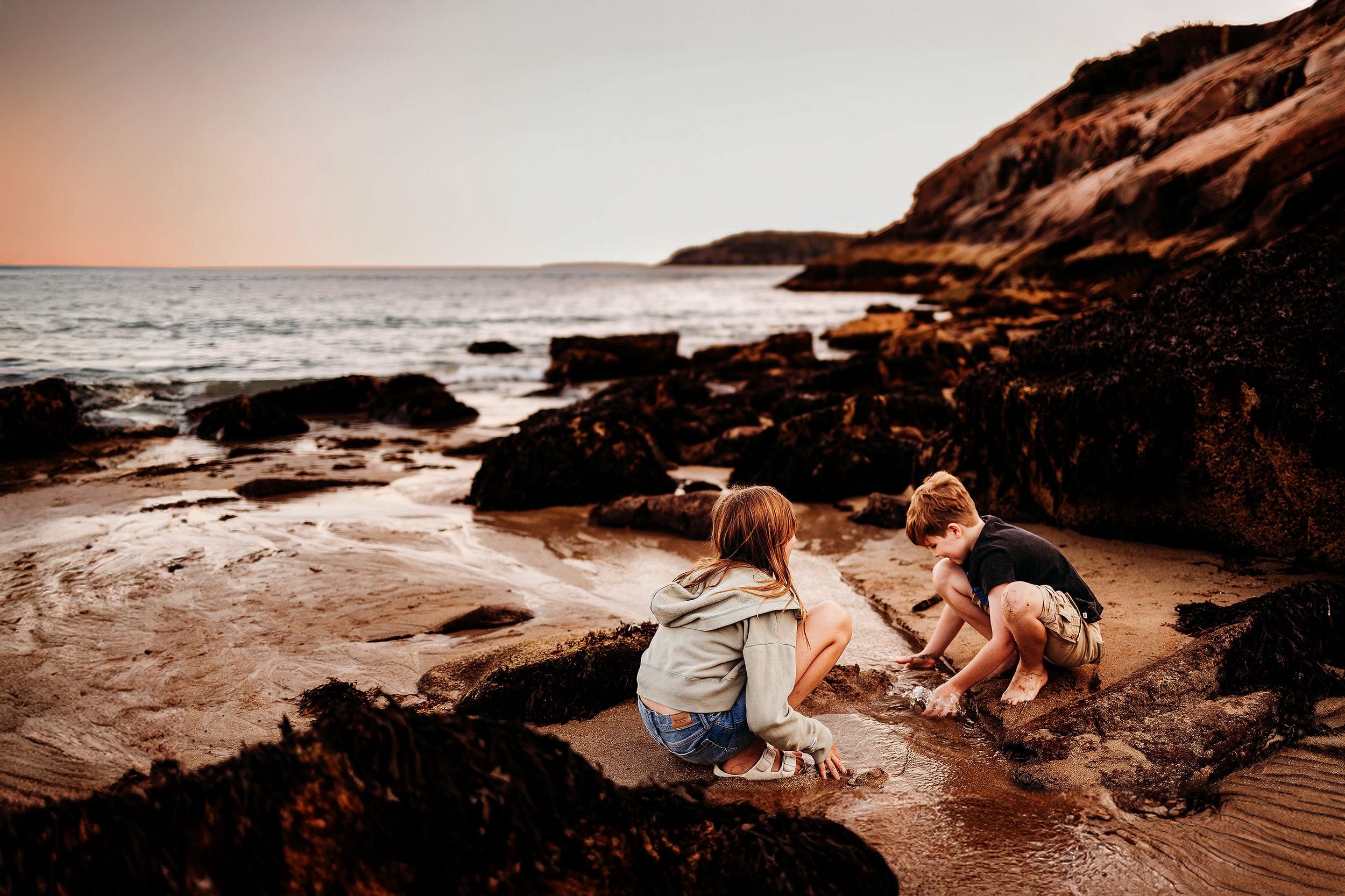 Photo of children playing on beach in Acadia National Park