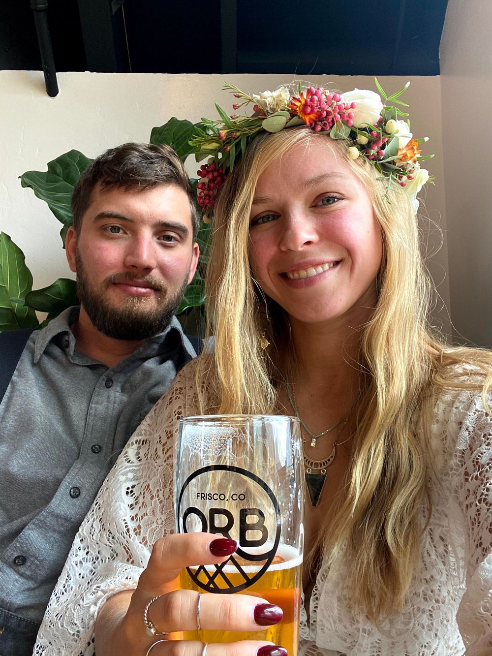 Couple in wedding outfits at Outer Bounds Brewing in Colorado