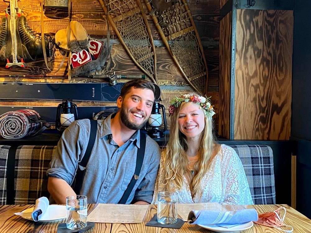 Couple sitting at table in Cabin themed restaurant