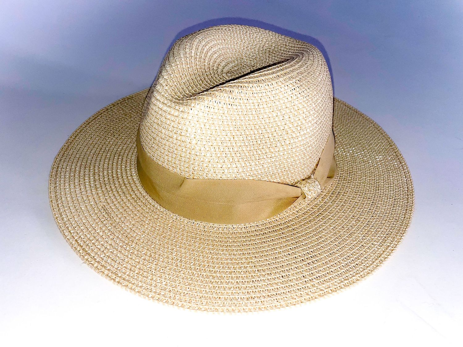 Natural straw sun hat photographed from different angles.