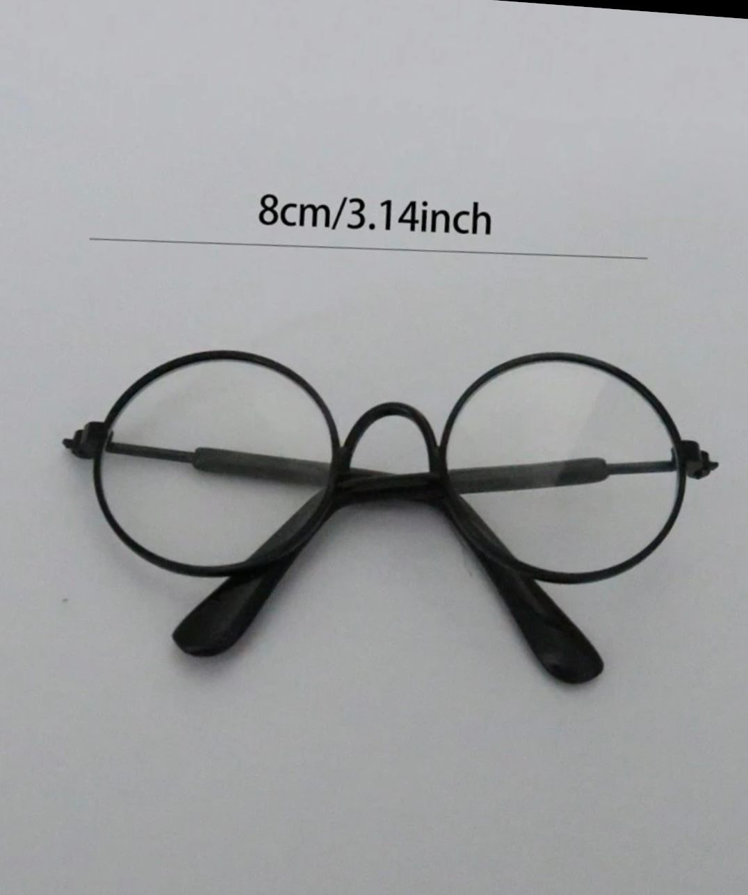 Black rimless eyeglass frames shown from multiple angles with measurement text.