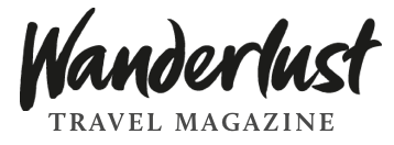 A black and white vintage-style logo for Wanderlust Travel Magazine with stylized lettering.
