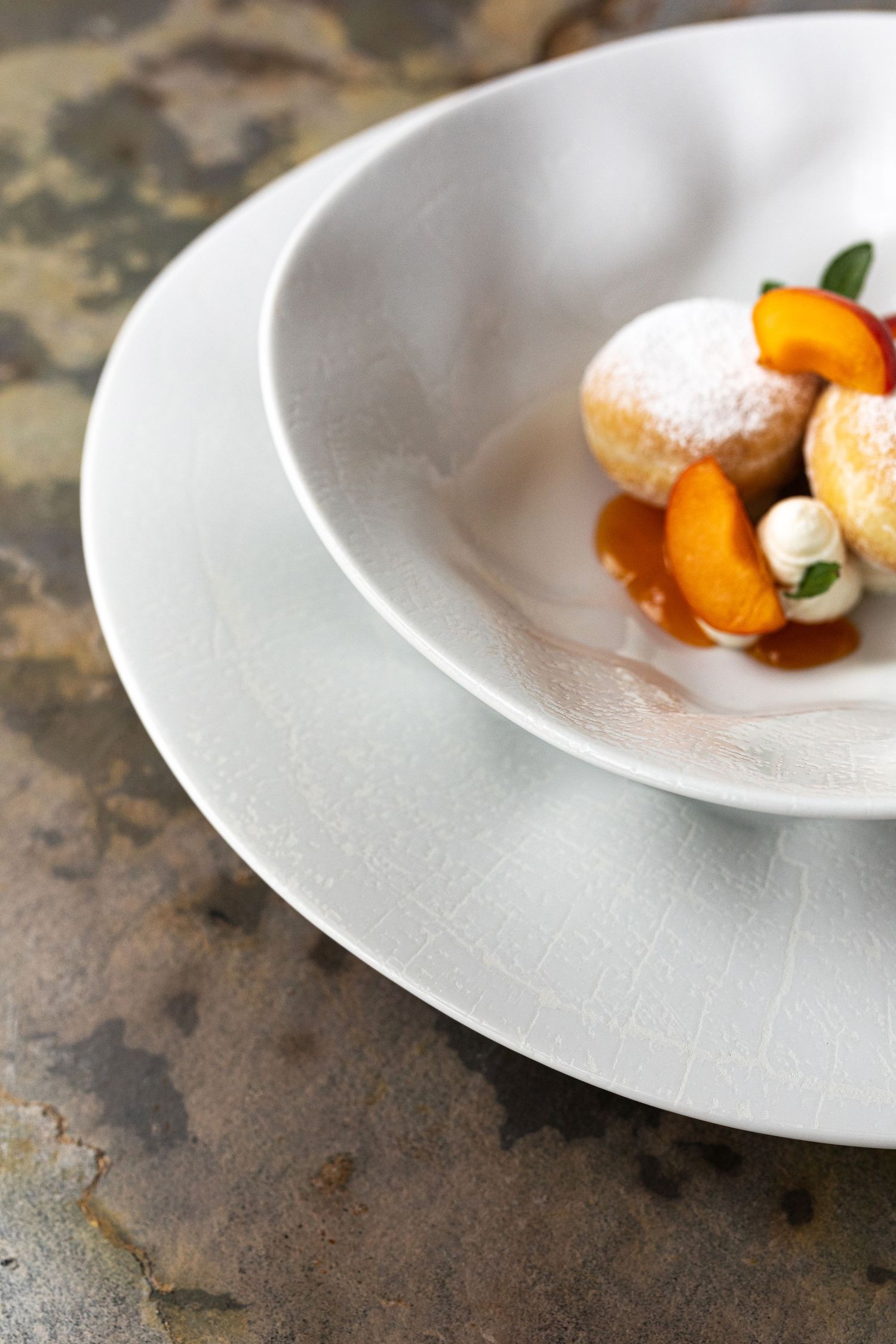 A porcelain plate with a delicate crackle glaze design,showcasing the intricate texture and pattern of the digital print