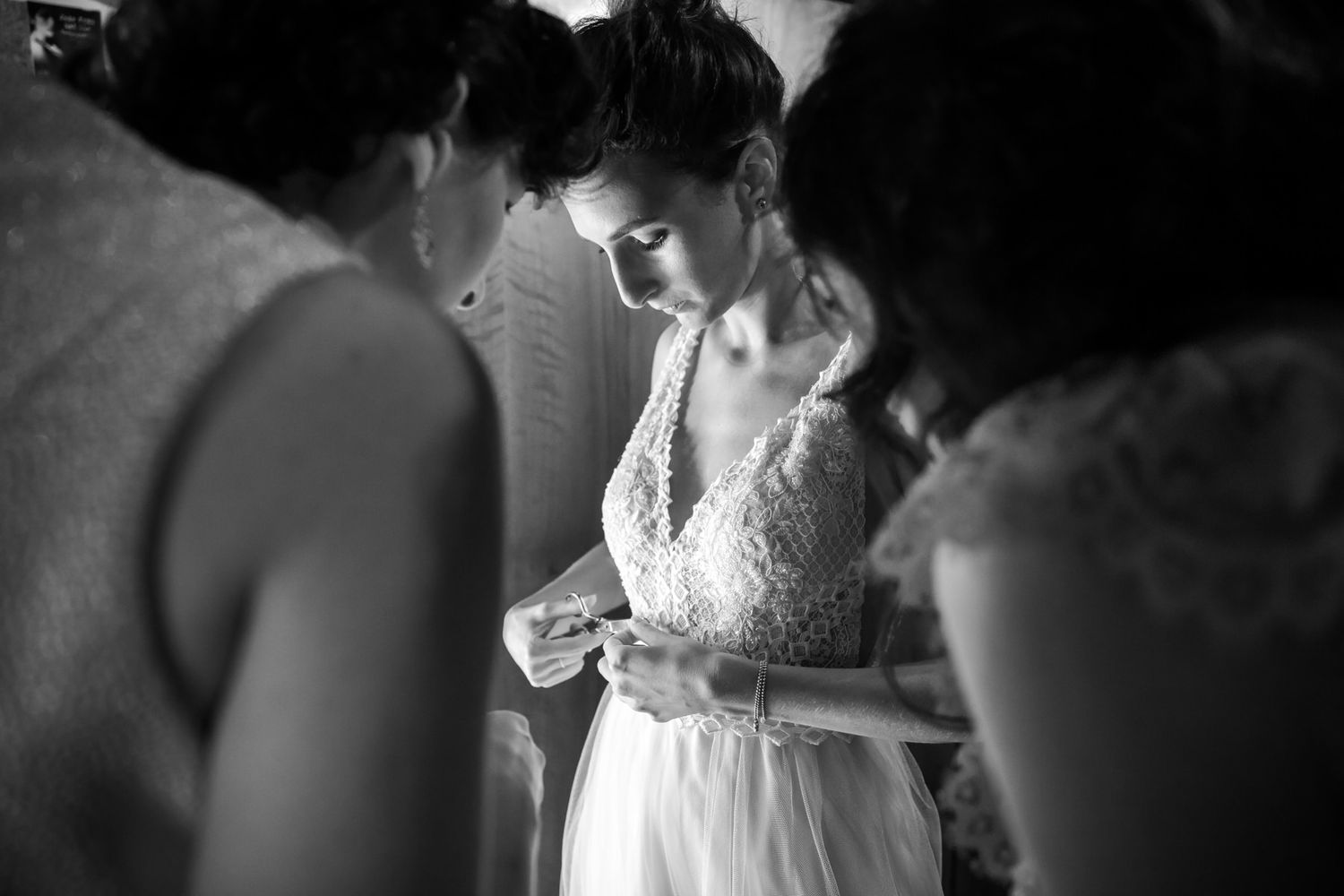 Intimate black and white wedding photography moments captured in a church setting.