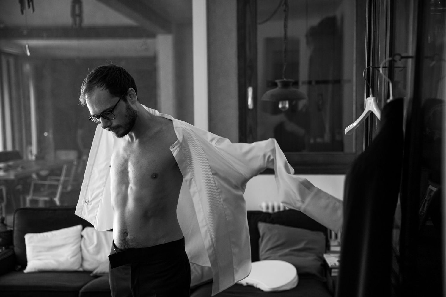 Monochrome sequence of wedding preparation moments in an interior setting.