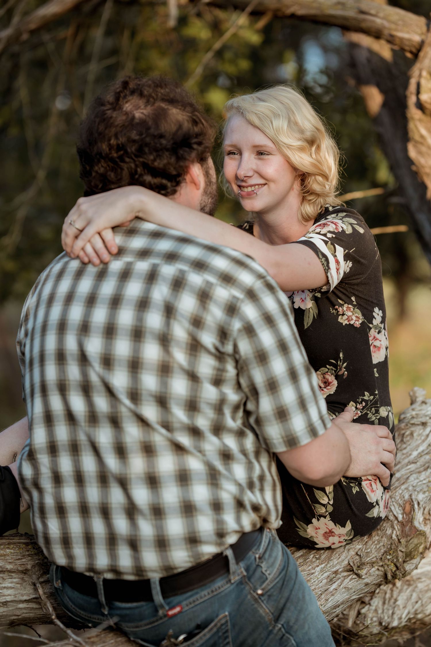 A loving hug between the couple, conveying warmth and affection