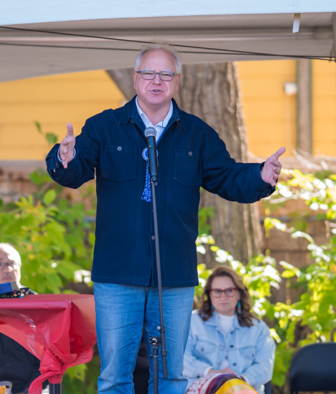 A portrait of Tim Walz, Governor of Minnesota, captured during a public appearance