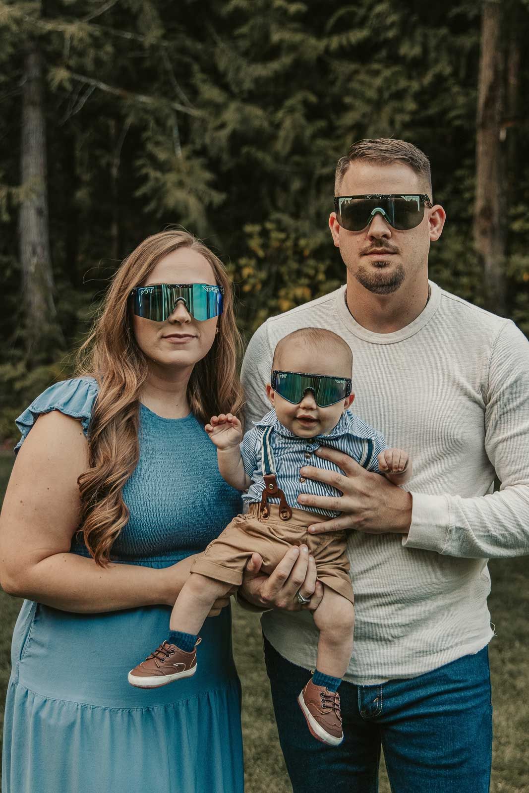 well-rested-family-smiling-and-enjoying-their-portrait-session-in-coeur-d-alene-with-matching-sunglasses
