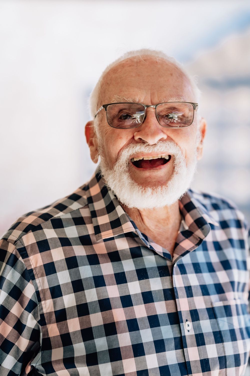 A portrait of an elderly man, looking directly at the camera.