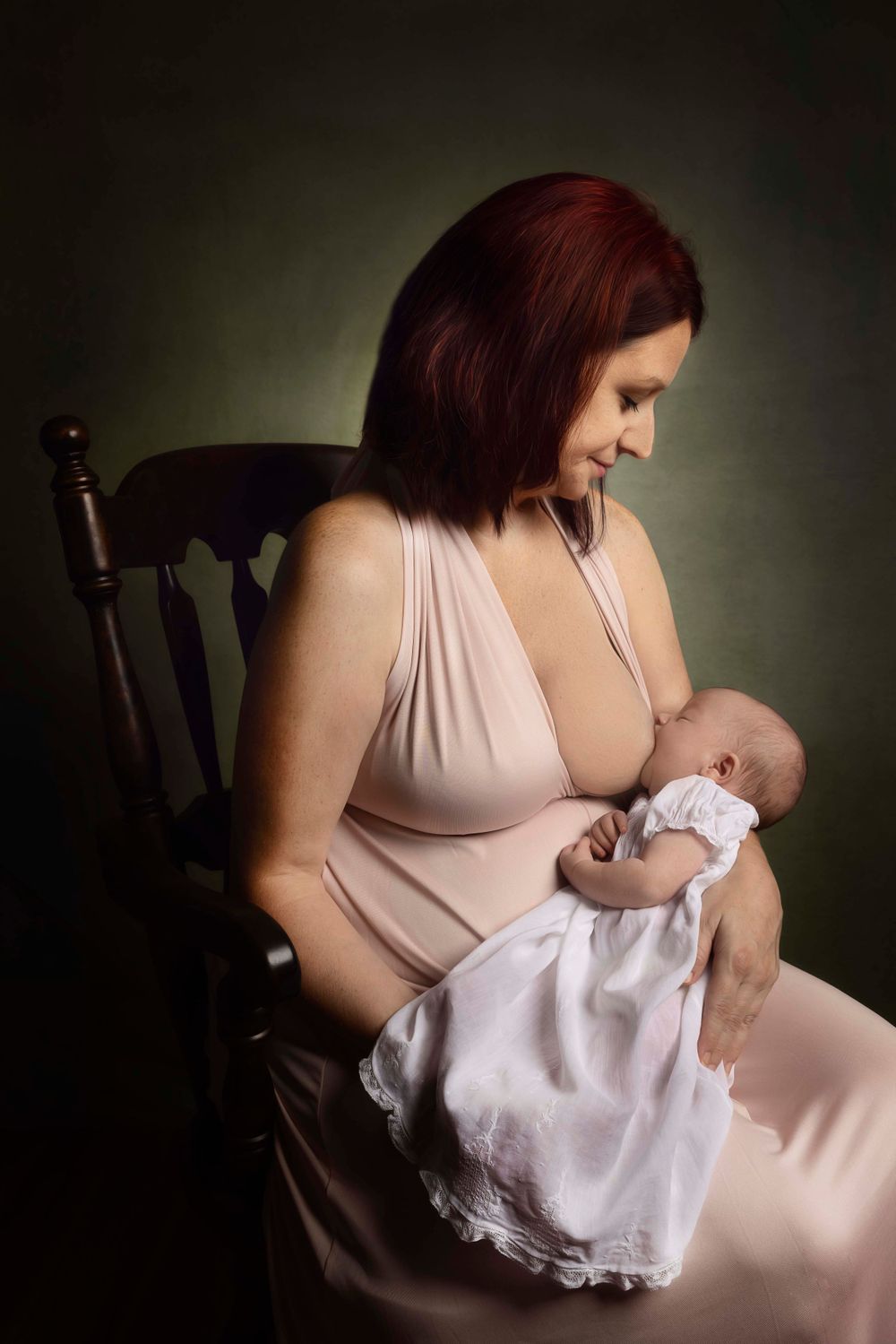 Mother breastfeeding a newborn baby