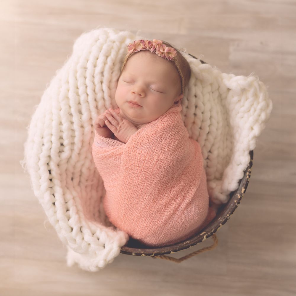 Newborn baby girl taken in basket