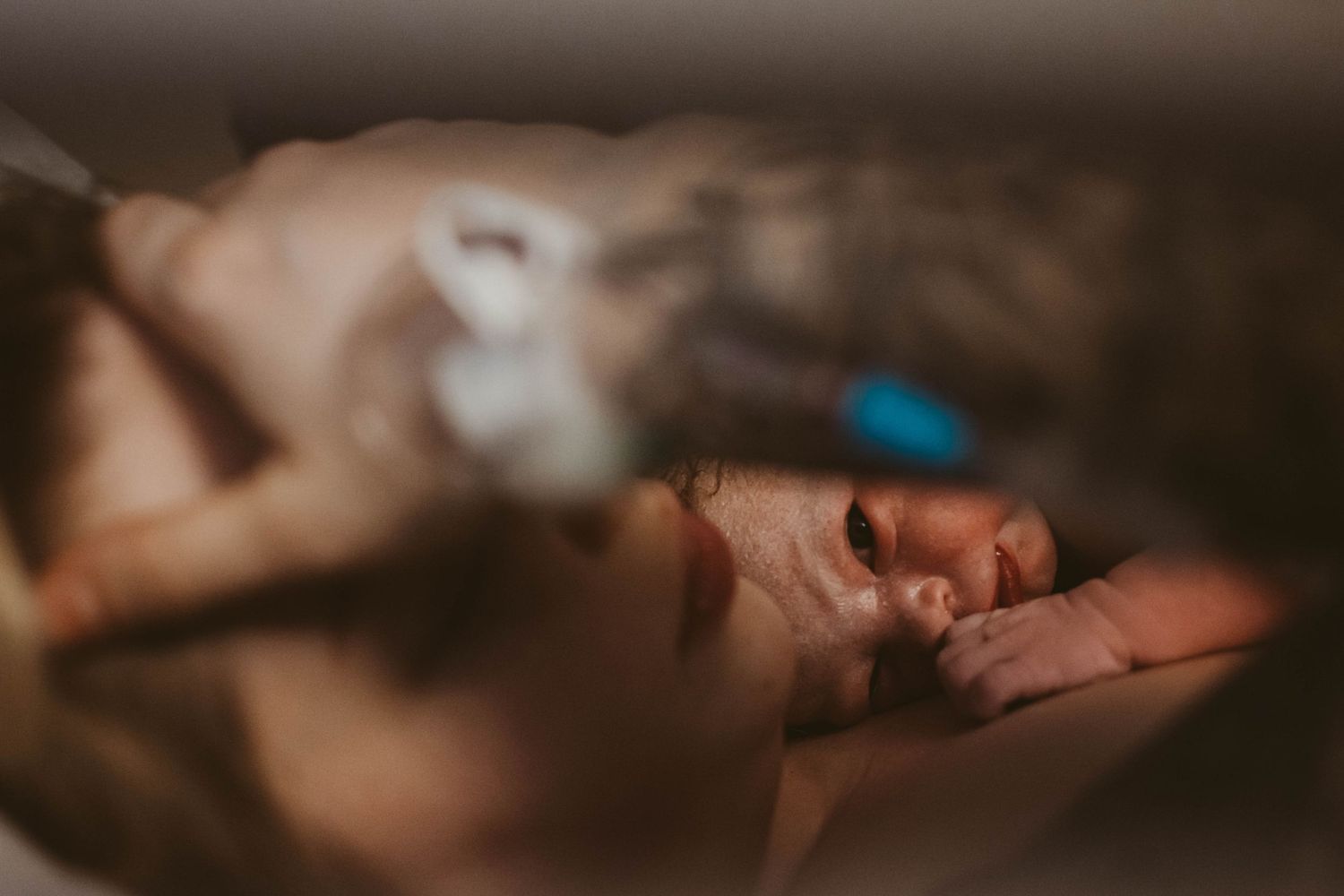 Hospital room interior with soft focus and warm ambient lighting.