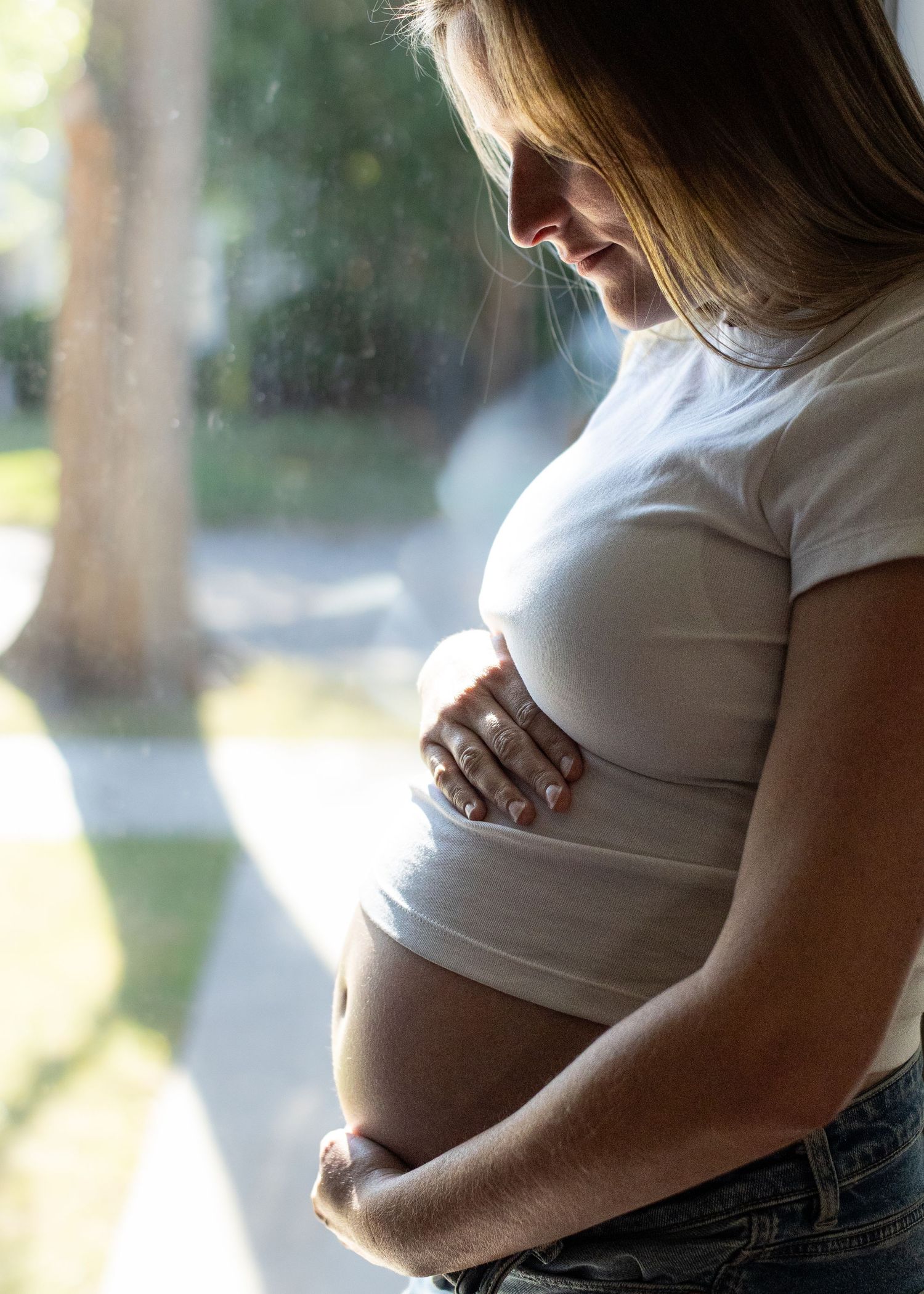 In home Maternity photos - mother's lit silhouette