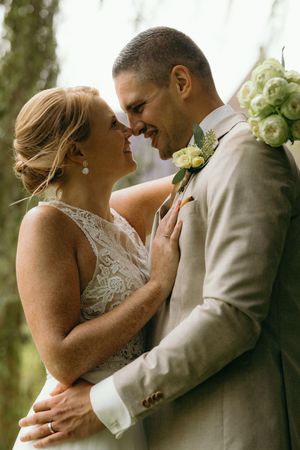 Tender wedding moment captured in a series of intimate embraces.