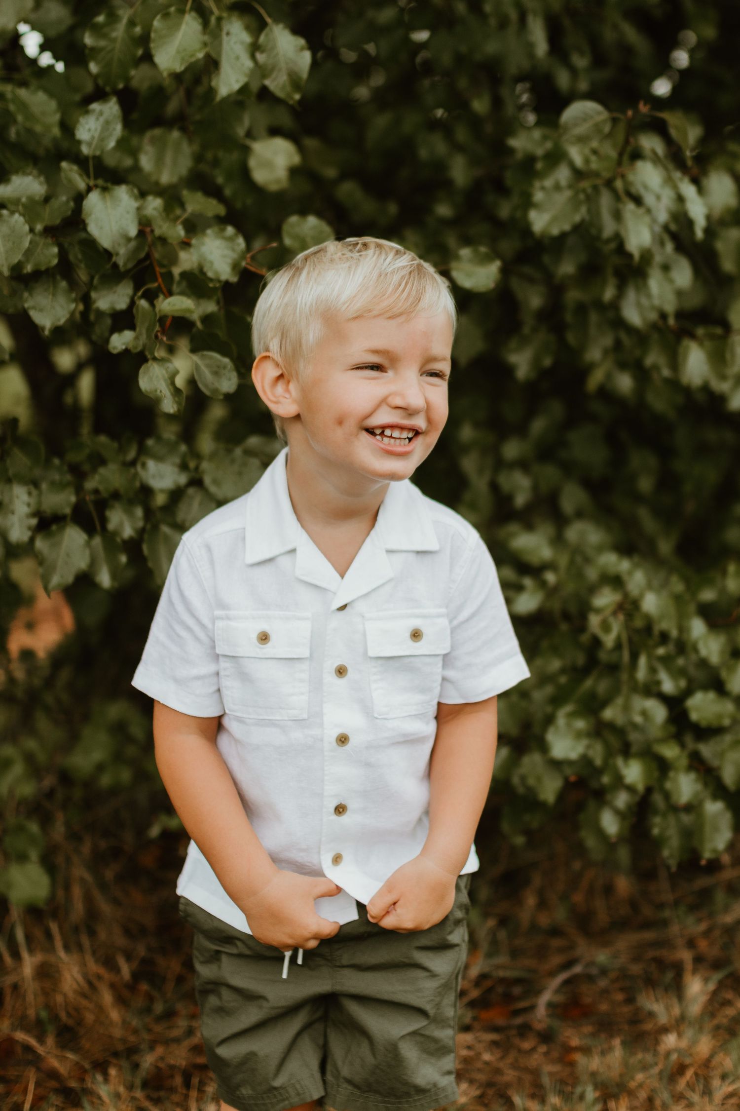 Inman South Carolina Family Photographer. Holston Creek park outdoor family photoshoot. Boy smiling at camera.