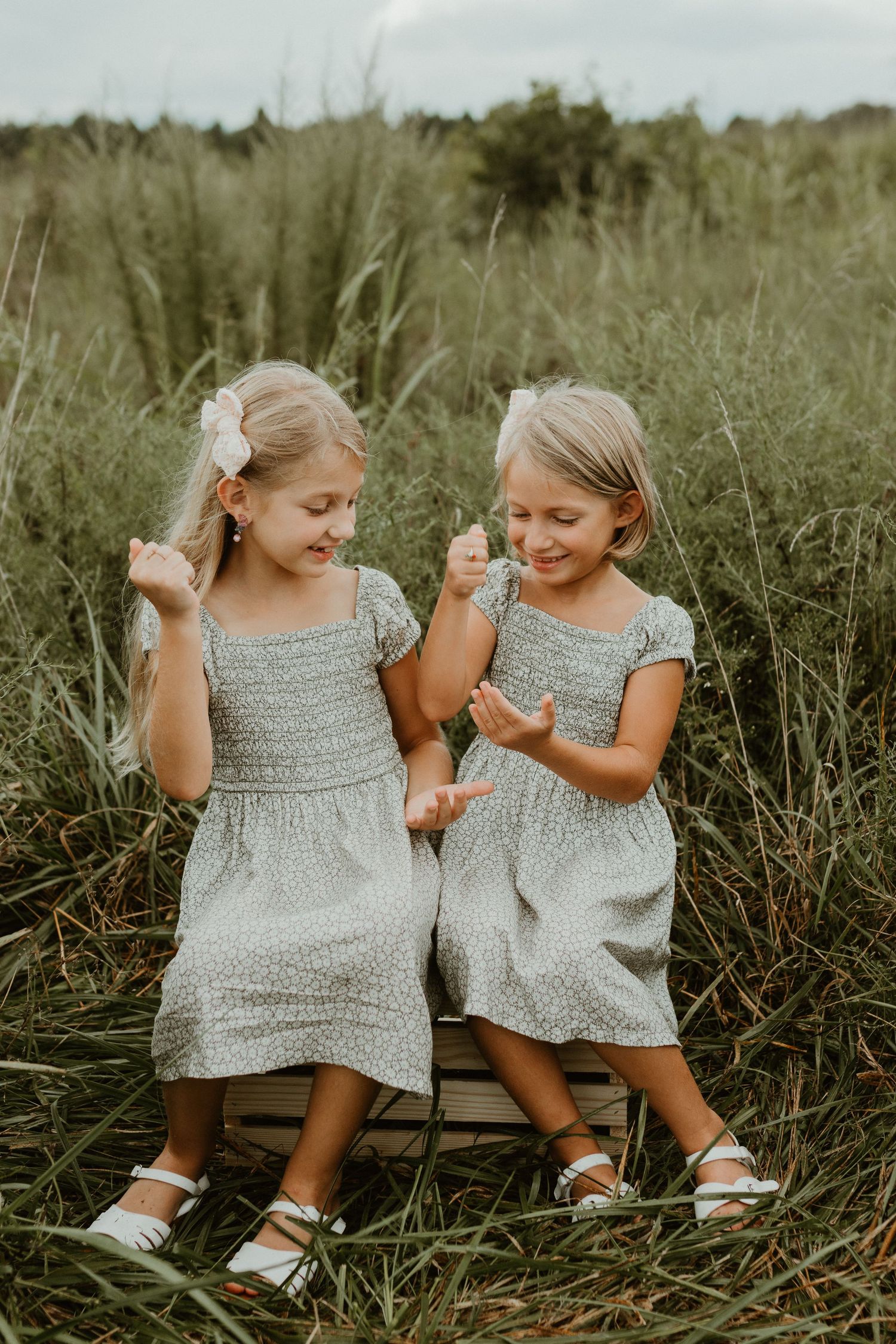 Inman South Carolina Family Photographer. Holston Creek park outdoor family photoshoot. Kid sisters playing during photoshoot Photosbyallii