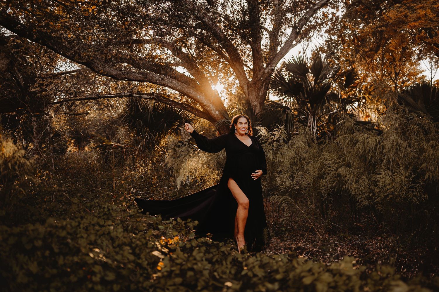 A stylish portrait session in a natural setting with dramatic sunset lighting.