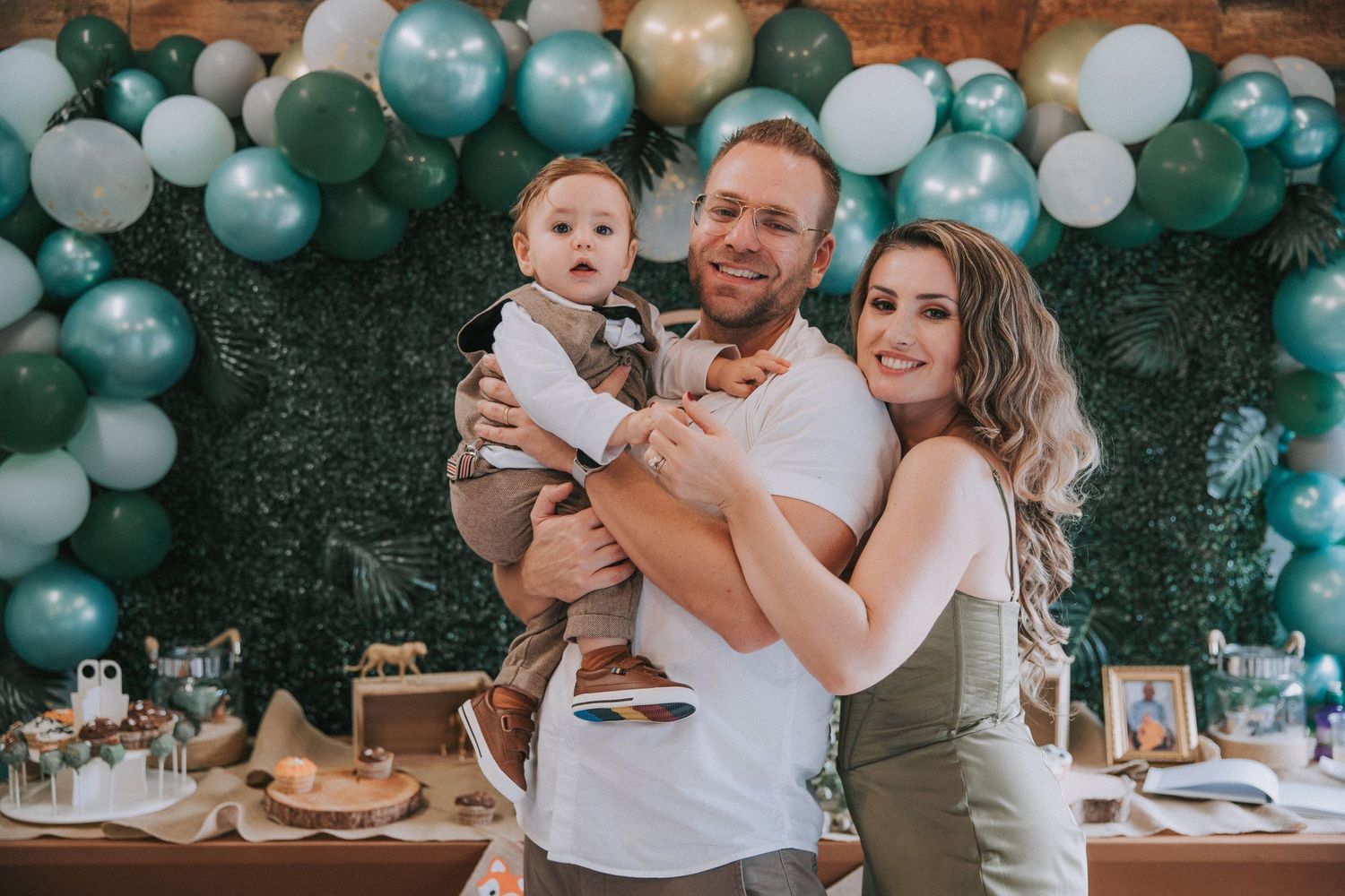 professional photography family of three at a birthday party event