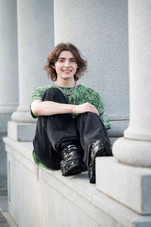 Three connected images show someone in a black outfit reclining on white stone steps with architectural columns in the background.