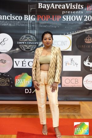 Fashion show event with branded backdrop and red carpet at San Francisco pop-up show.